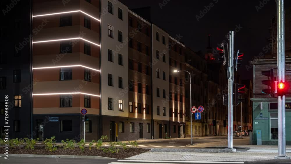 Busy intersection in city of Riga Latvia, timelapse of traffic at night