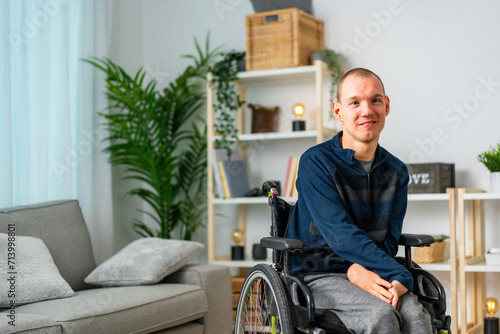 Bild auf Leinwand Portrait of a cheerful disabled man chilling at home