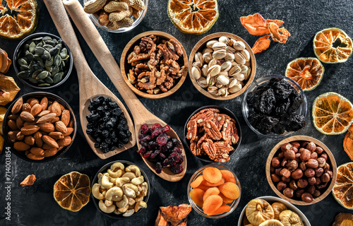 Composition with a variety of dried fruits and assorted nuts.