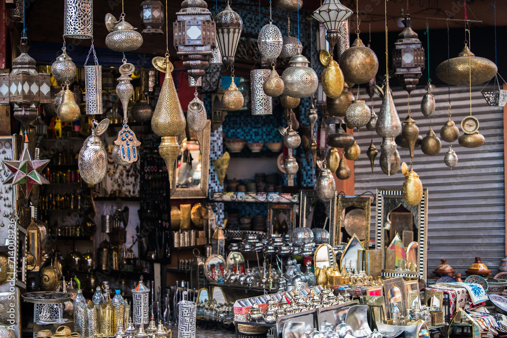 Marrakech, Morocco - March 28, 2022: All kinds of souvenirs exhibited in a shop in the ancient district of Medina in Marrakech.