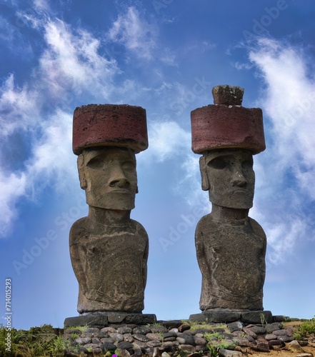 Two Moai statues of Easter Island (Chile) with pukao topknot photo