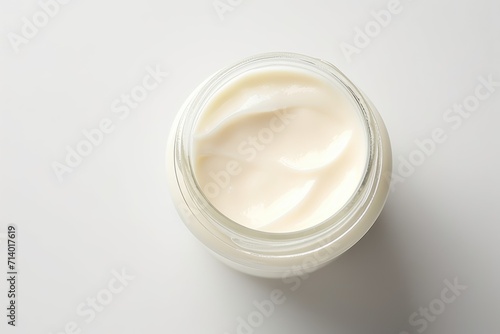 close-up of the delicate texture of cream in a jar on a light background, minimalism