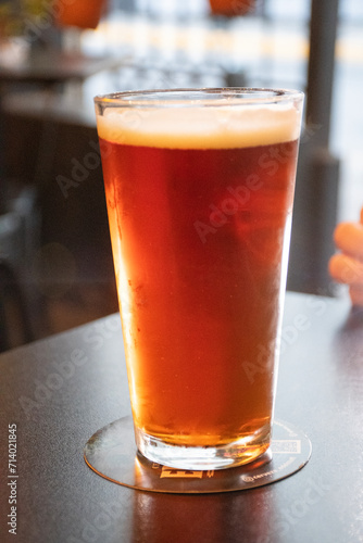 refreshing glass of craft ale ipa beer on pub table