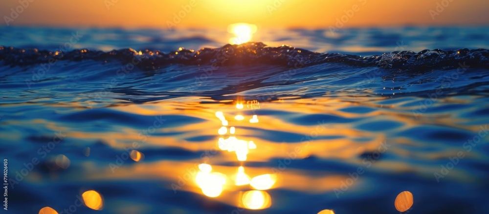 Sunset over water in golden and blue hues.