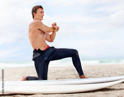 Photography Surfer, man is stretching and beach with surfboard for ocean waves and start fitness, adventure and travel
