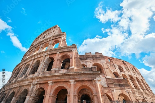 The Colosseum, Architectural wonder of Roman Empire (Colosseo) with blue sky background and clouds, Rome, Italy