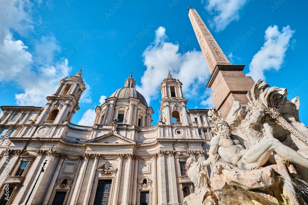 Fountain of Four Rivers (Fontana dei Quattro Fiumi) and Baroque style Sant Agnese in Agone Church on Navona square, Rome, Italy