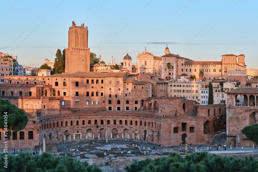 The archeological ruins of Rome's historic center, named Imperial Fora and the Trajan's Market ruins at sunset, Rome, Italy