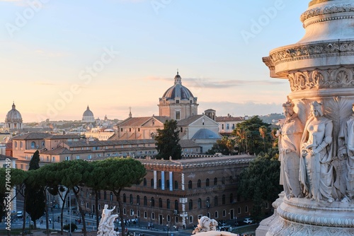 Rome cityscape view and Gesu Church's dome from Monument of Victor Emmanuel II or II Vittoriano at sunset in Piazza, Rome, Italy  photo