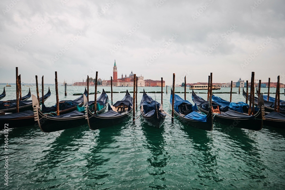 Traditional gondolas with the bell tower of the Saint Giorgio Maggiore Church on background (view from San Marco), Venice, Italy