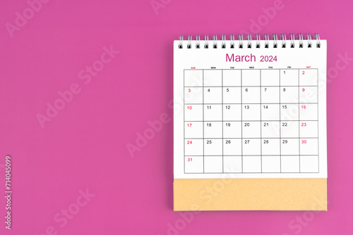 March 2024, Monthly desk calendar for 2023 year on purple background.