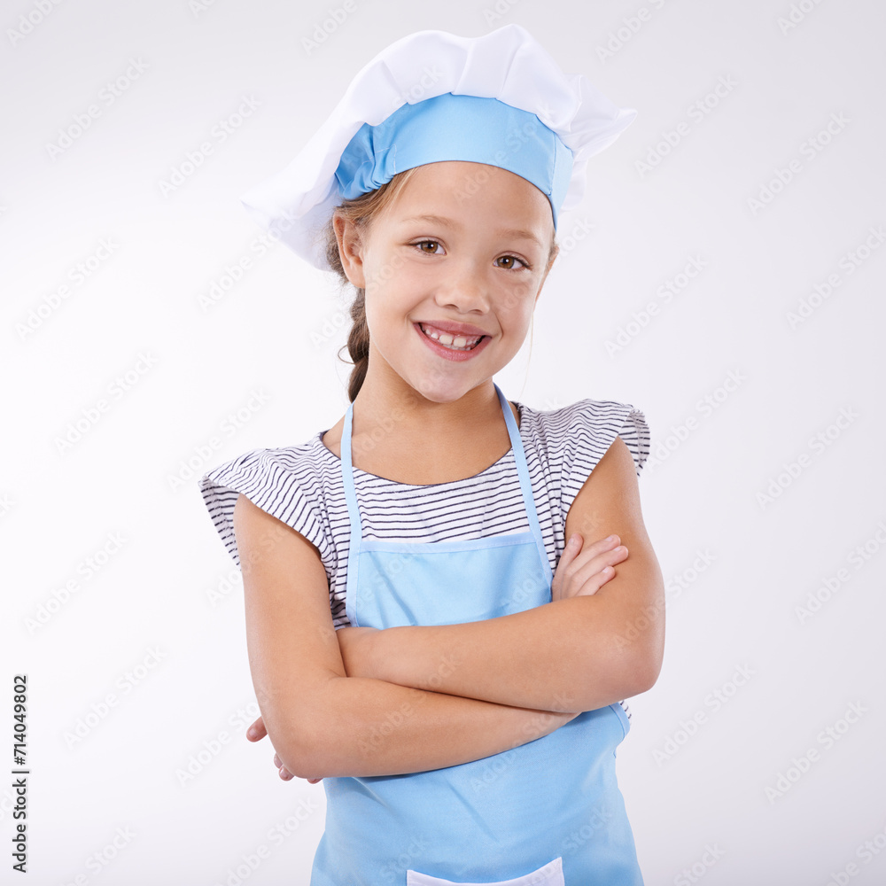 Kid, chef and portrait with arms crossed, confident and child development on white background. Culinary skills, happy and ready to cook food and childhood growth with face in hospitality industry Kid, chef and portrait with arms crossed, confident and child development on white background. Culinary skills, happy and ready to cook food and childhood growth with face in hospitality industry