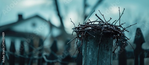 Thorny crown on post near Christian church during Lent