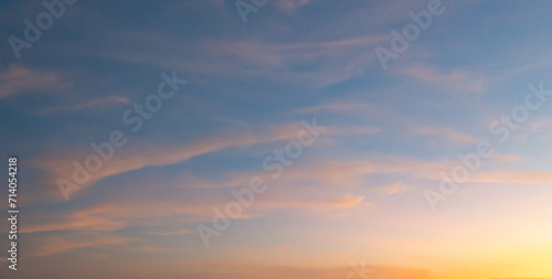 Sunset sky. Abstract nature background. Dramatic blue with orange colorful clouds in twilight time. © tampatra
