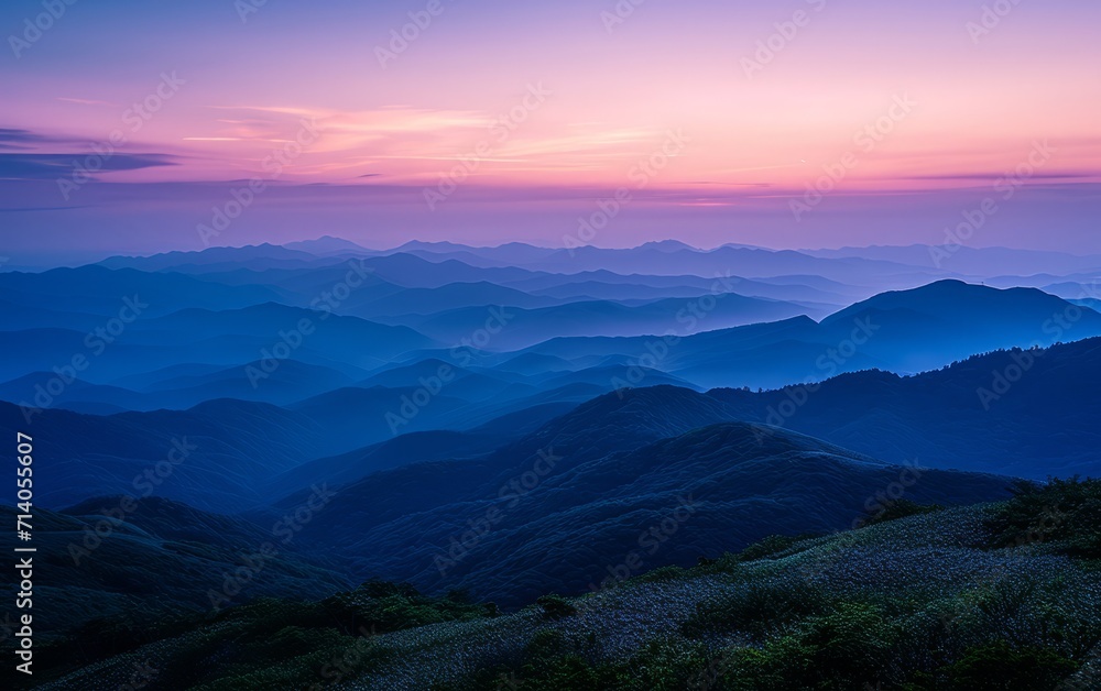 Obraz premium Sunset Over Misty Blue Mountains and Forest