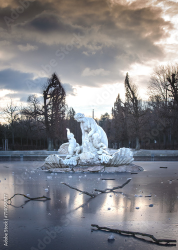 Photography Classical park fountain sculpture of a woman and a child angel with frozen water