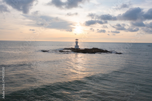 Aerial top view of lighthouse tower, Khao Lak with seawater, Andaman sea in Phang Nga Bay island in summer season, Thailand. Tourist attraction.
