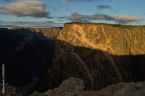 Golden sunlight on Painted Rock at Black Canyon National Park