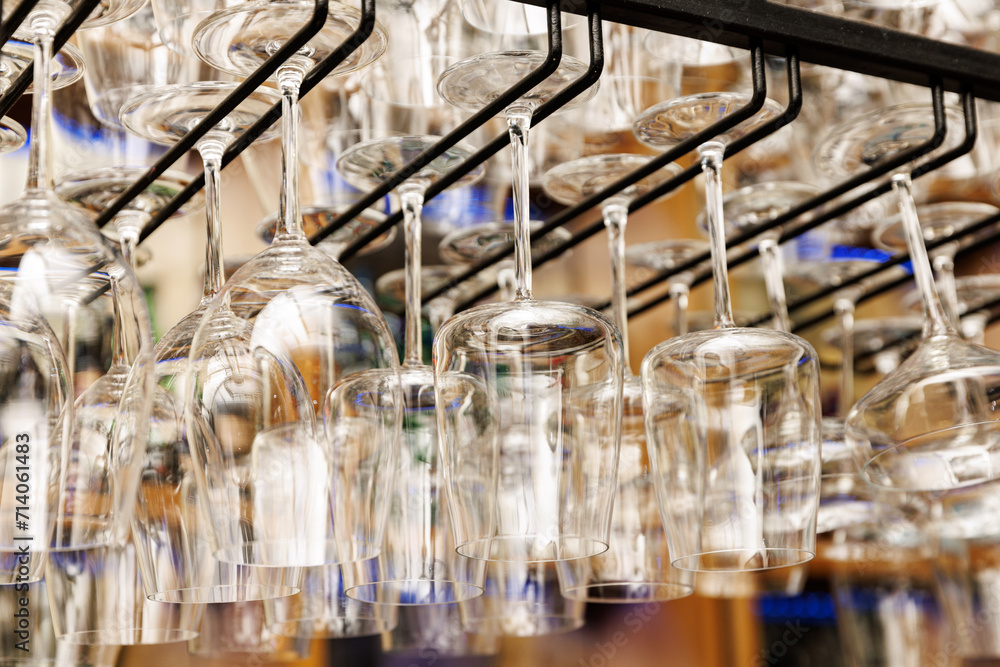 Empty glass clean upside-down stemware in nightclub or a restaurant. Empty glass clean upside-down stemware in nightclub or a restaurant.