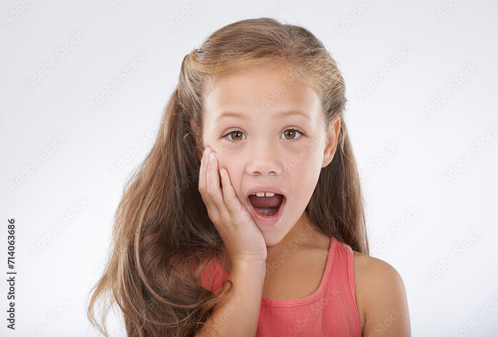 Child, portrait and hand for surprise news in studio for announcement, information or review. Female person, face and shocked on white background for giveaway secret as wow mockup, winner or drama Child, portrait and hand for surprise news in studio for announcement, information or review. Female person, face and shocked on white background for giveaway secret as wow mockup, winner or drama