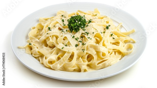 Fettuccine Alfredo on a white plate, isolated against a white background