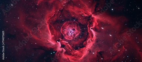 Unicorn constellation's rosette nebula emits red H-alpha radiation, resembling a rose flower shape.