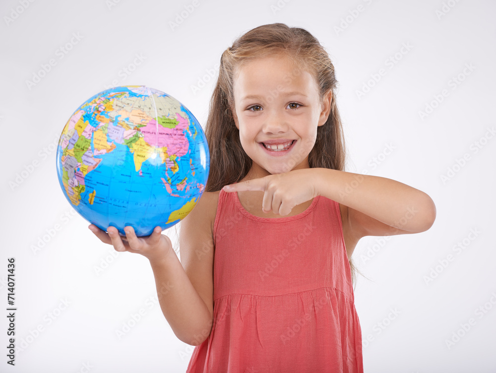 Child, pointing to globe in studio with world, planets and city for education, geography and portrait. Student, girl kid and travel map with smile for earth day support or ecology on white background Child, pointing to globe in studio with world, planets and city for education, geography and portrait. Student, girl kid and travel map with smile for earth day support or ecology on white background