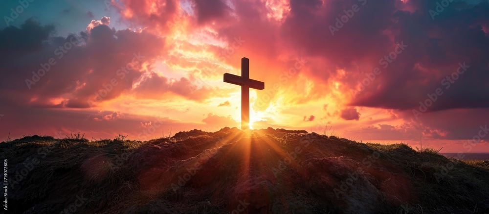 The sunrise and Easter Cross create a powerful Easter photo, symbolizing Jesus' crucifixion and resurrection.