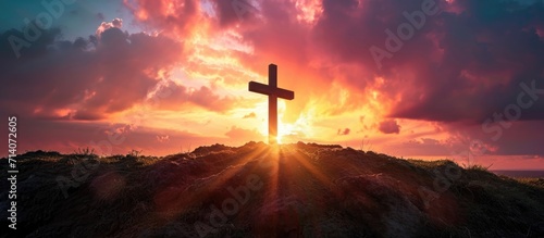 The sunrise and Easter Cross create a powerful Easter photo, symbolizing Jesus' crucifixion and resurrection. photo