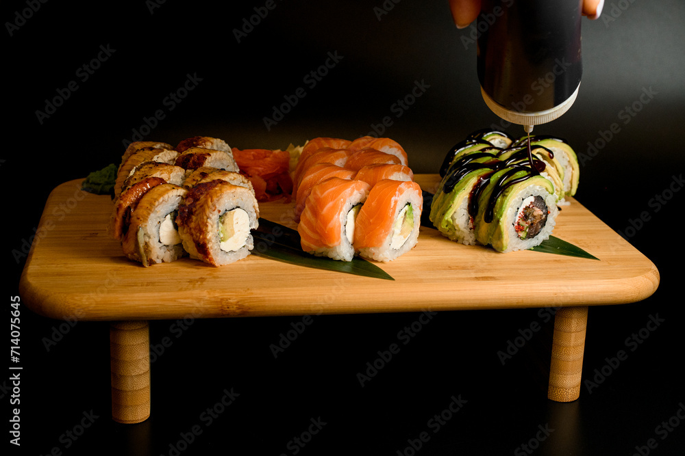 Fotografie Triple delight. Eel, salmon, and avocado trio
