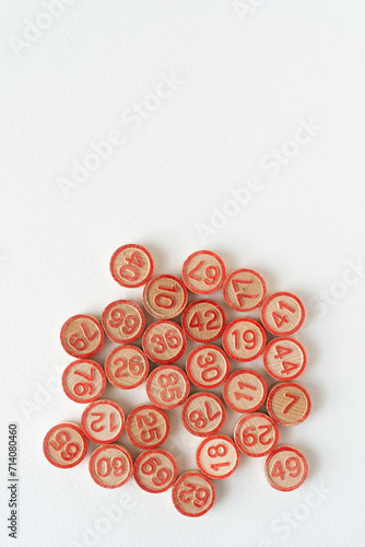 wooden circles with numbers on blank paper
