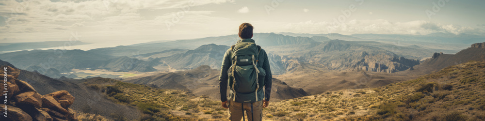 Traveler looking at view and stand in front of An adventure destination,  offering thrilling outdoor activities