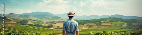 Traveler looking at view and stand in front of A picturesque vineyard, offering tastings amid scenic landscapes