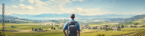 Traveler looking at view and stand in front of A tranquil countryside, dotted with charming villages and rolling hills