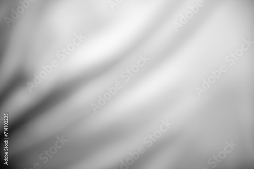Smooth Silver Waves on Luxurious White Satin Silk: Elegant Texture Background with Grey Metallic Flowing Pattern