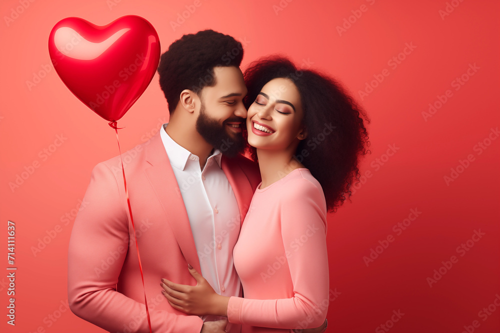 Happy African American and Mixed Race Couple With Heart Balloon for Valentines Day Coral Background Happy African American and Mixed Race Couple With Heart Balloon for Valentines Day Coral Background