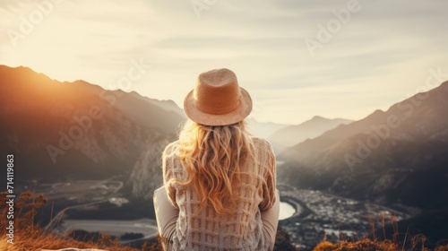 A girl in a hat and a sweater on the background of the mountains. Generative AI