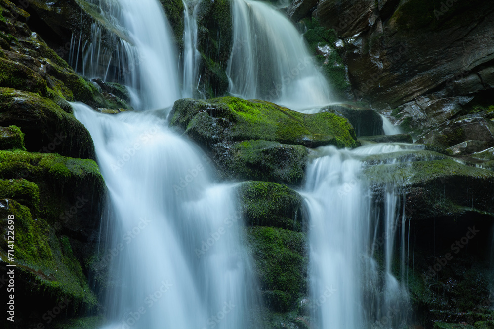 Beautiful natural waterfall. Foliage in beautiful natural waterfall. Horizontal image.