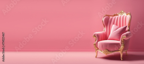 A pink chair on a pink background. photo