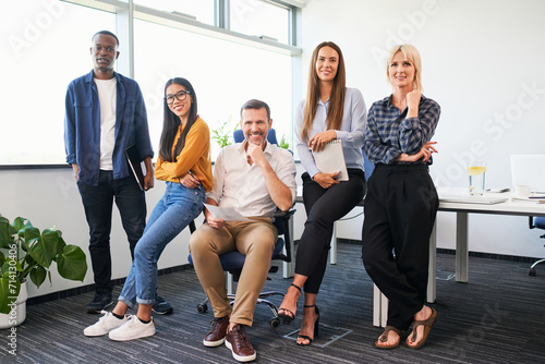 Group portrait of diverse team of colleagues at office