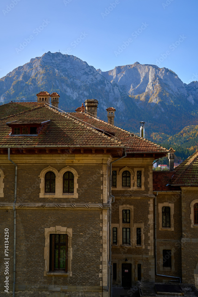 Hillside castle with mountain range in the sunset, near the town of Busteni, Transylvania, Romania Hillside castle with mountain range in the sunset, near the town of Busteni, Transylvania, Romania