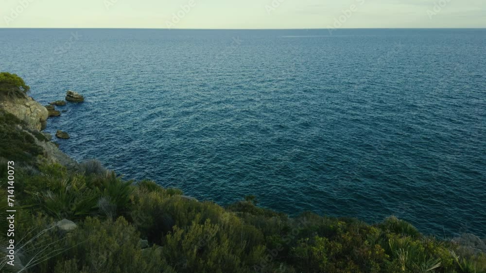 Province of Castellon. Rocks and turquoise sea with waves. Favorite place for active walks. VIA VERDE BENICASIM OROPESA. Oropesa del Mar Province of Castellon. Rocks and turquoise sea with waves. Favorite place for active walks. VIA VERDE BENICASIM OROPESA. Oropesa del Mar