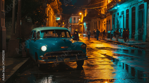 Habana street at night, typical vintage cars in the capital of Cuba