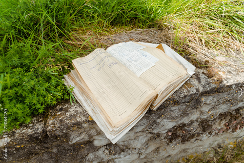 An old ledger abandoned on a destroyed foundation.