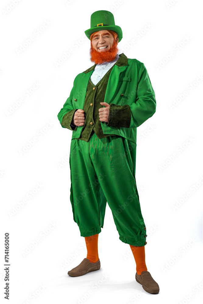 Leprechaun elf on St. Patrick's Day. Cheerful character Irish leprechaun for advertising with a red natural beard in a green suit and green hat for advertising. Cosplay at the festival on March 17th
