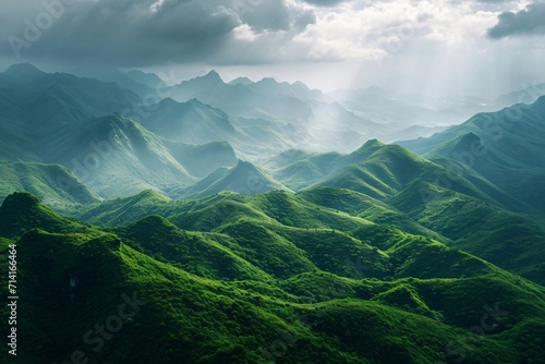 beautiful green scenery with many mountains below