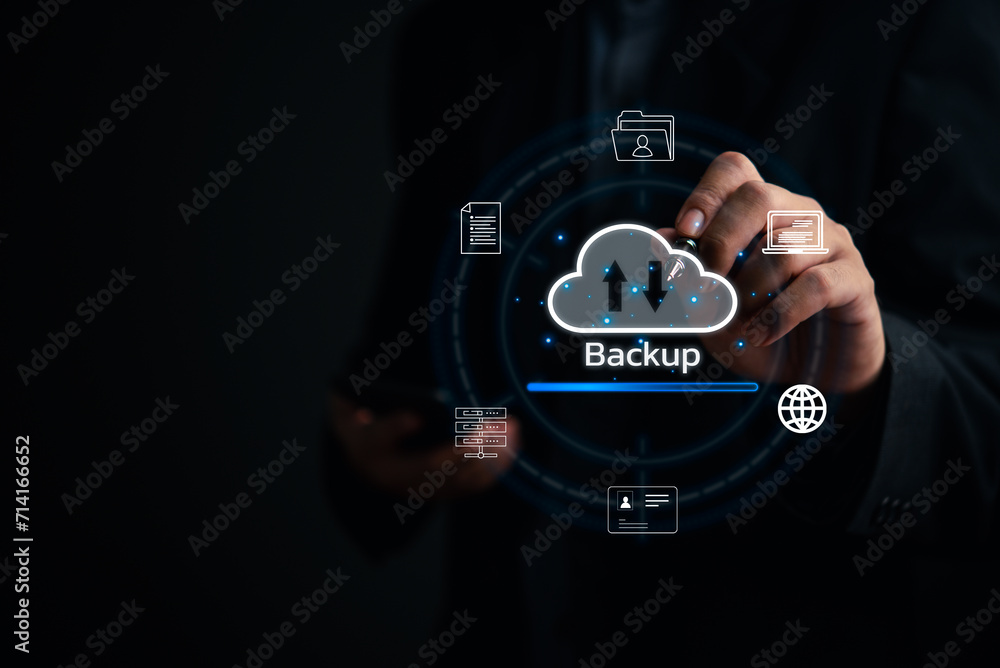 Businessman Interacting with a Backup Interface virtual cloud network data security system internet online with futuristic holographic digital technology. Businessman Interacting with a Backup Interface virtual cloud network data security system internet online with futuristic holographic digital technology.