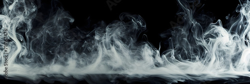Real smoke exploding and swirling outwards. Dramatic smoke or fog effect for spooky Halloween or other dramatic background.