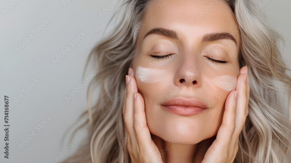 Senior Woman Touching Perfect Skin - Mid-50s Aged Woman in Anti-Aging Beauty Portrait