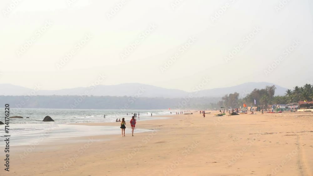 People walking on Agonda beach, South Goa, India People walking on Agonda beach, South Goa, India